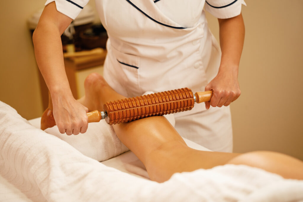 Unrecognizable woman during maderotherapy at the spa.